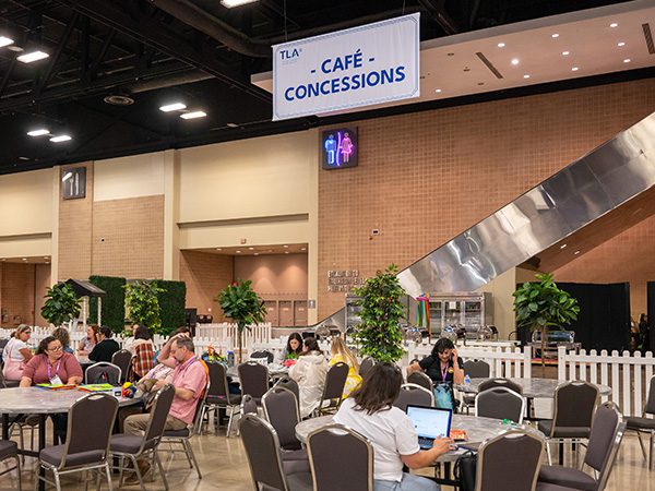 Hall Cafe in the TLA conference exhibit hall with people at tables