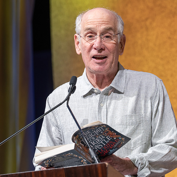 Louis Sachar-TLA 2025 Keynote reading from his book on stage at TLA's Annual Conference