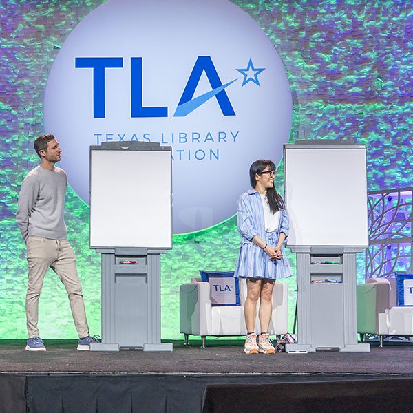 TLA 2026 Illustrators Sketch Off with two illustrators with drawing pads on stands