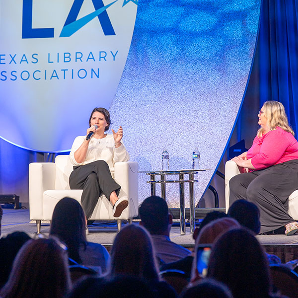 Taylor Jenkins Reid-TLA 2025 Keynote sitting in a chair with interviewer