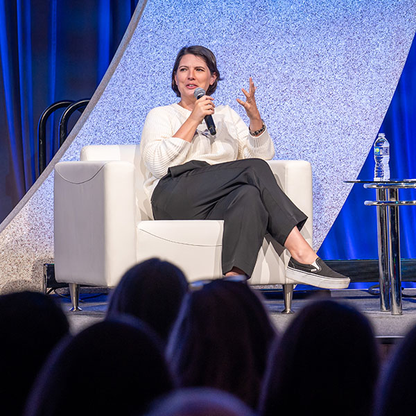Taylor Jenkins Reid-TLA 2025 Annual Conference Keynote Speaker sitting in a chair