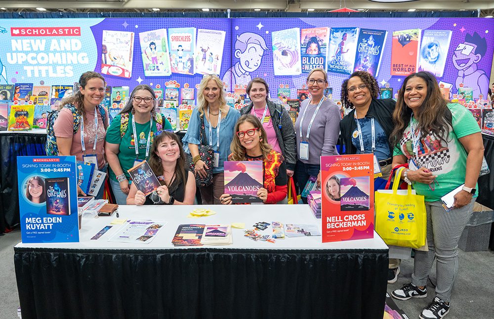 Group at exhibitor booth at TLA Annual Conference